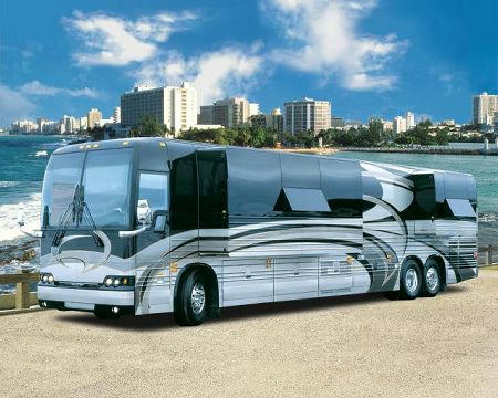 Side view of motorhome with city in the background, image is in full colour. 